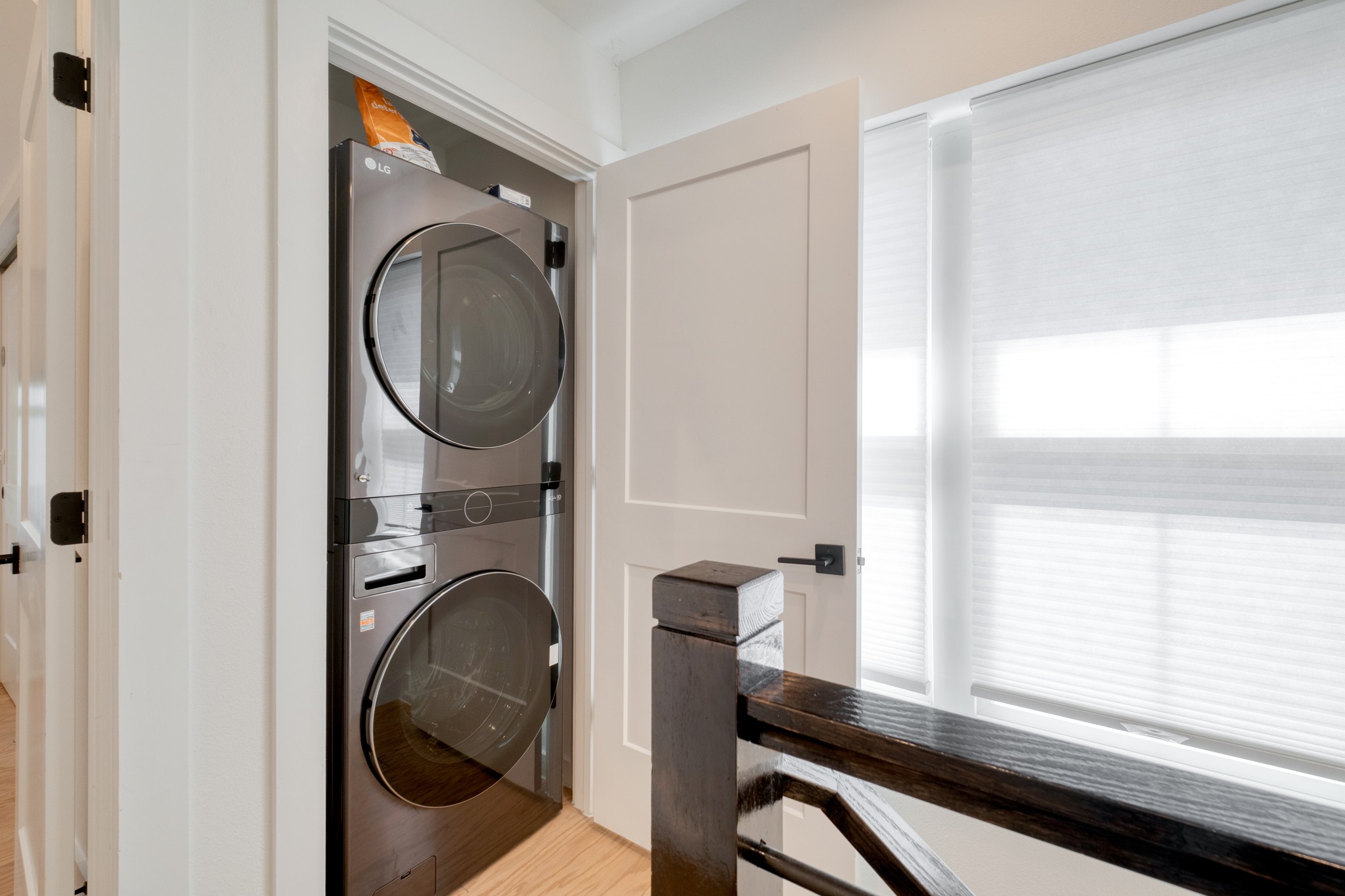 5406 Downs Drive, Unit 2 Austin, TX 78721 - Photo 20 of 24 a view of a hallway with a washer and dryer
