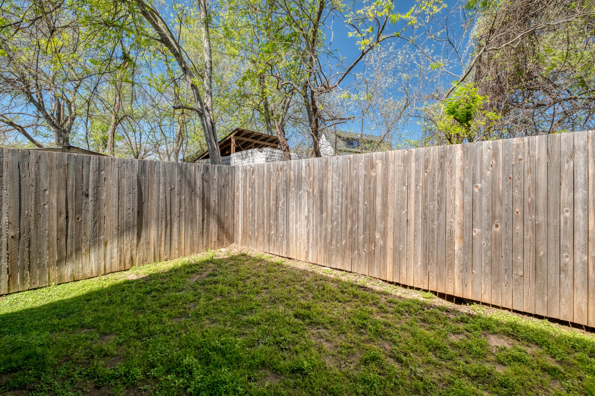 5406 Downs Drive, Unit 2 Austin, TX 78721 - Photo 21 of 24 a view of backyard with wooden fence
