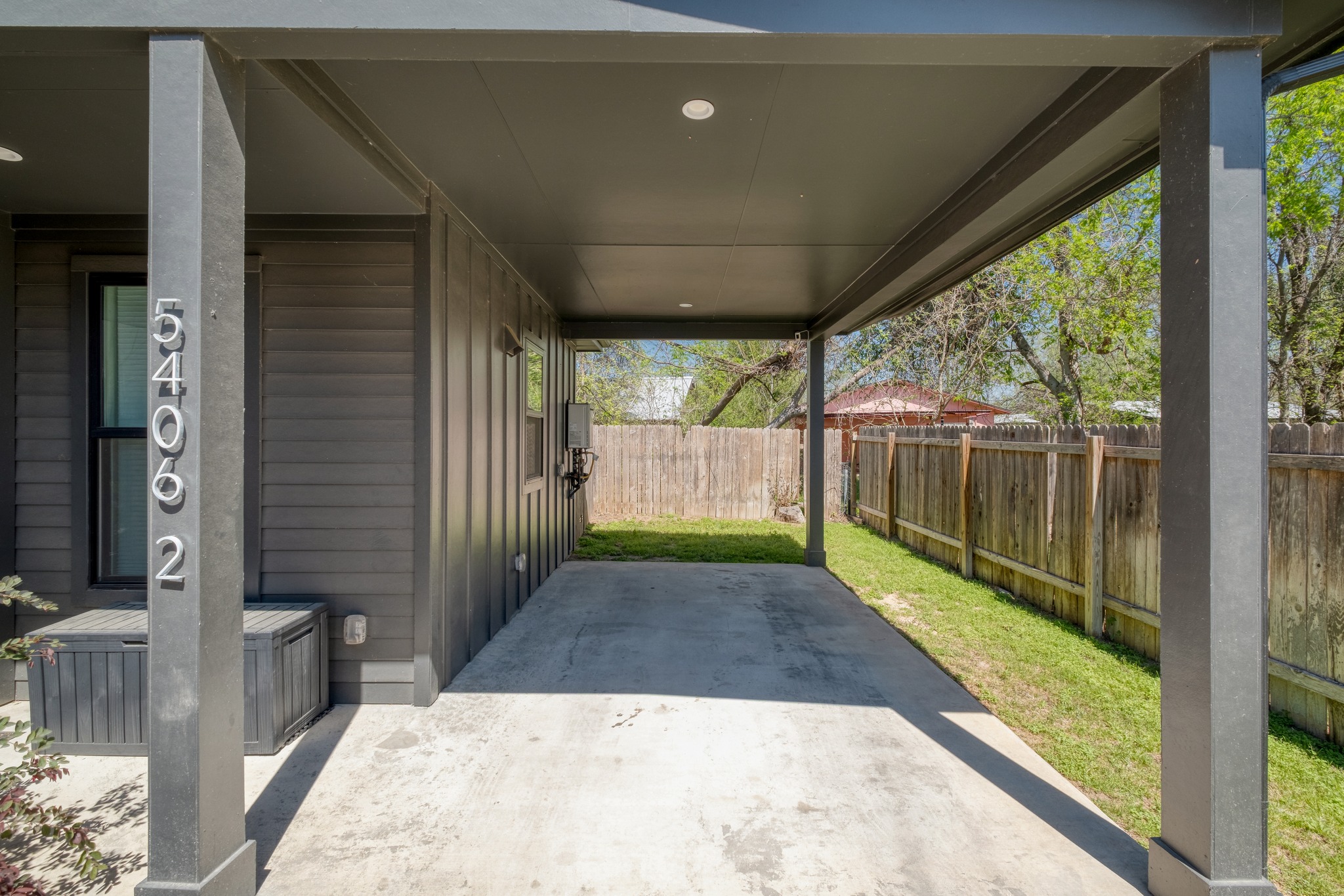 5406 Downs Drive, Unit 2 Austin, TX 78721 - Photo 24 of 24 a view of a porch with a floor to ceiling window and wooden floor