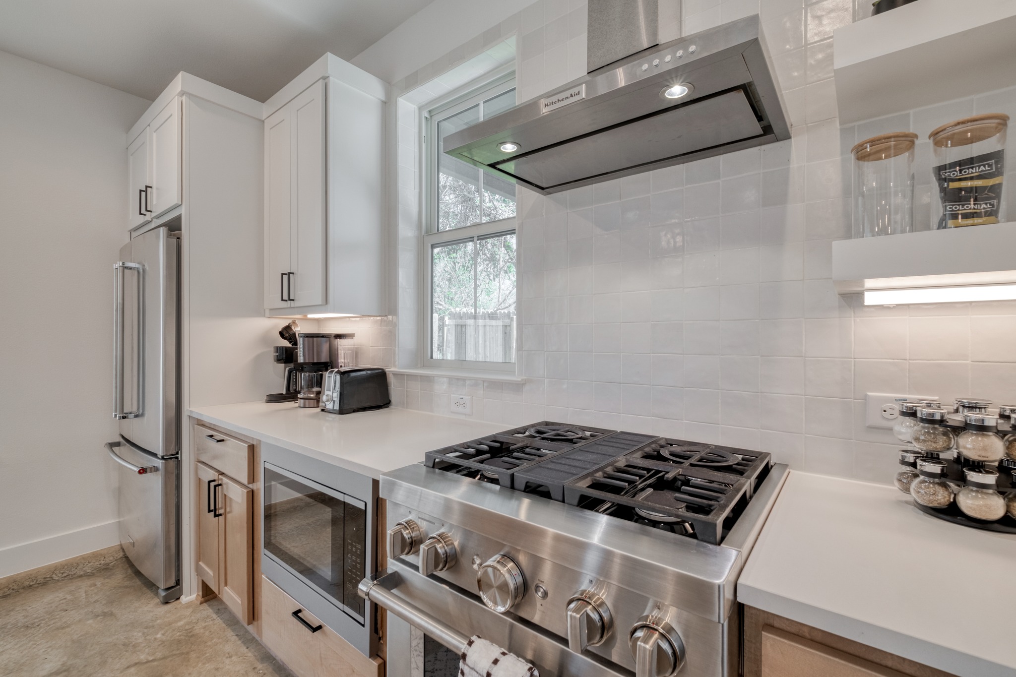 5406 Downs Drive, Unit 2 Austin, TX 78721 - Photo 6 of 24 a kitchen with stainless steel appliances a stove a sink and a refrigerator