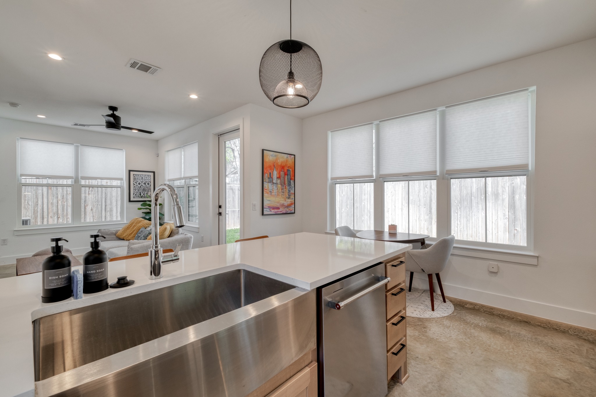 5406 Downs Drive, Unit 2 Austin, TX 78721 - Photo 7 of 24 a view of a kitchen area with furniture and windows