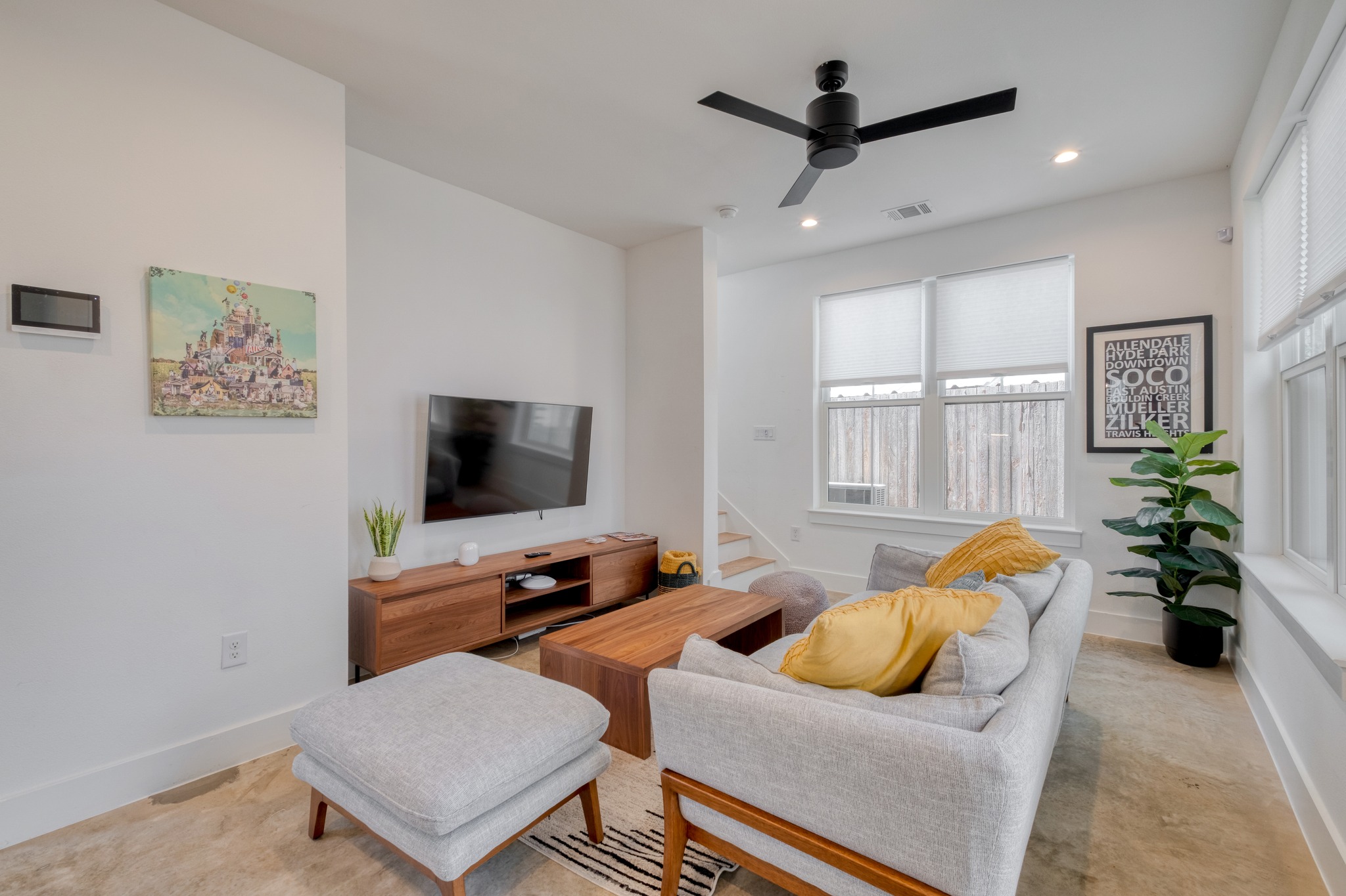 5406 Downs Drive, Unit 2 Austin, TX 78721 - Photo 9 of 24 a living room with furniture ceiling fan and a window