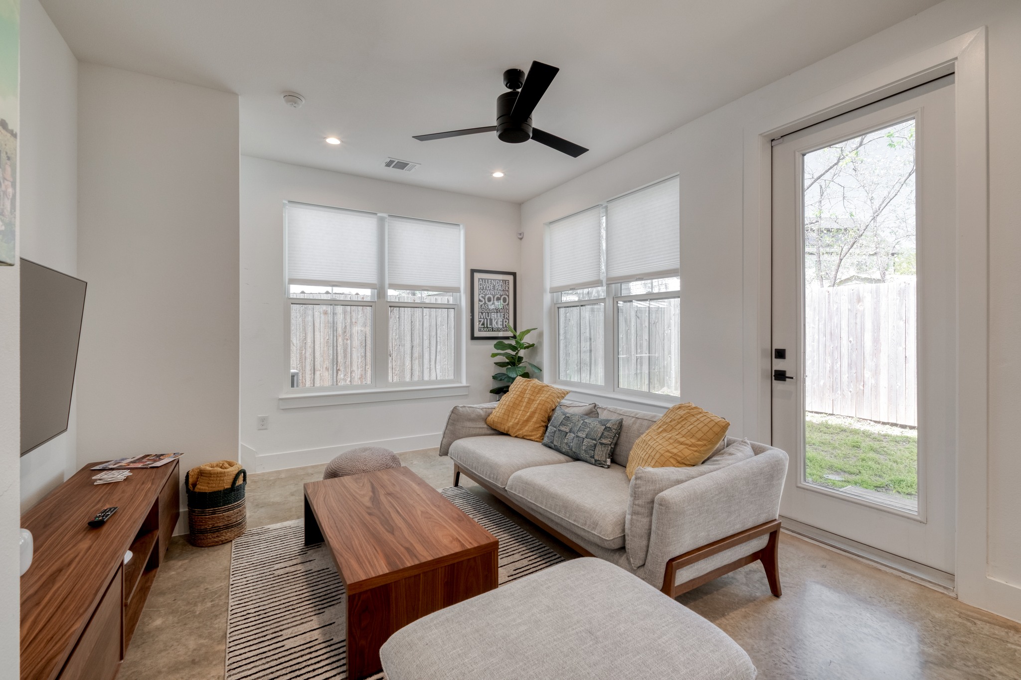 5406 Downs Drive, Unit 2 Austin, TX 78721 - Photo 10 of 24 a living room with furniture and a window