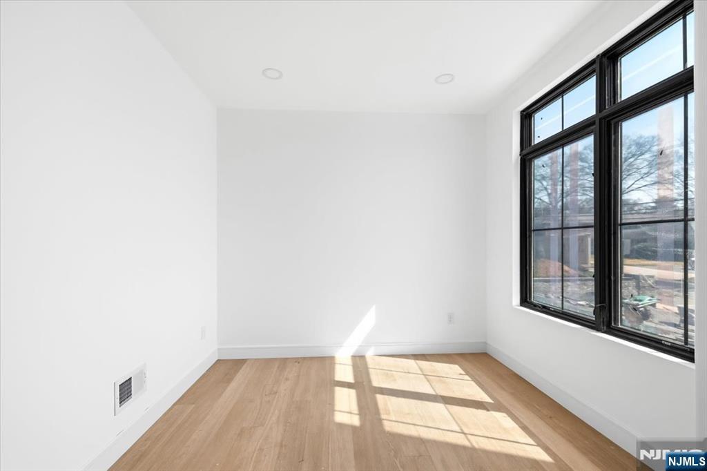 150 Howland Avenue River Edge, NJ 07661 - Photo 11 of 45 a view of an empty room with a window