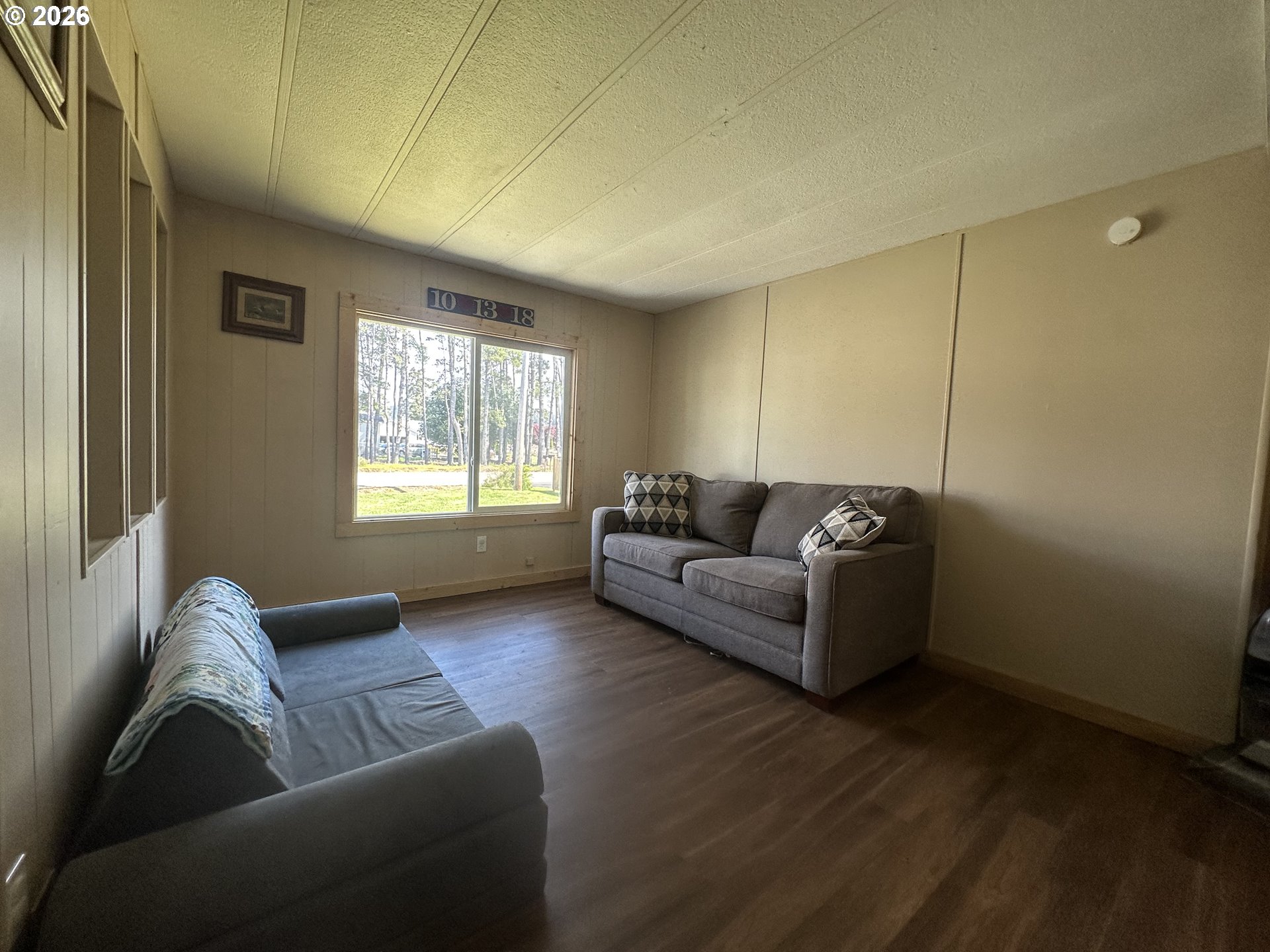 355 North 8th Street Lakeside, OR 97449 - Photo 14 of 22 a living room with furniture and a window