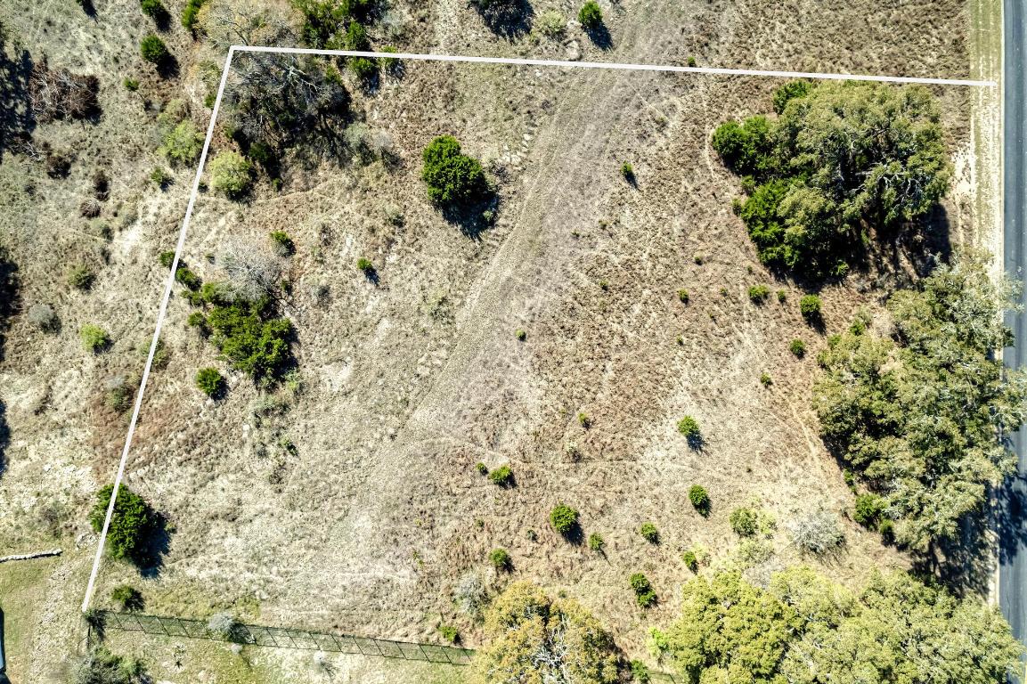 1281 Mystic Parkway Spring Branch, TX 78070 - Photo 5 of 20 a view of a yard with plants and wooden fence