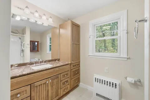 a bathroom with a sink a vanity and a mirror