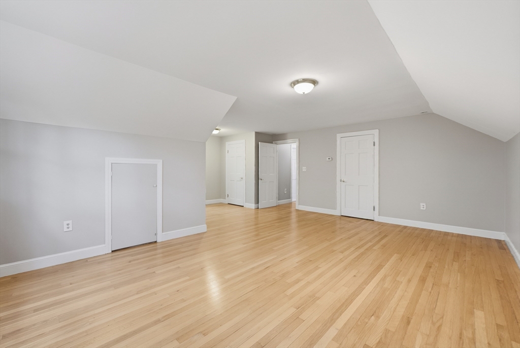 56 Century Mill Road Bolton, MA 01740 - Photo 28 of 41 a view of an empty room with wooden floor and a window