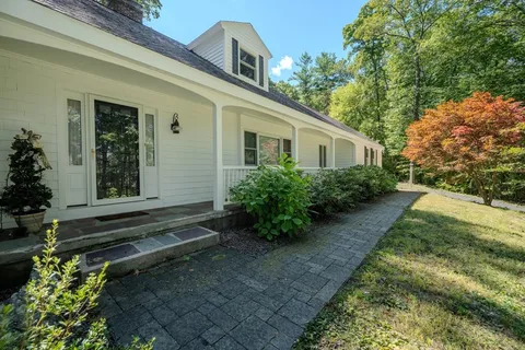 a house with trees in front of it