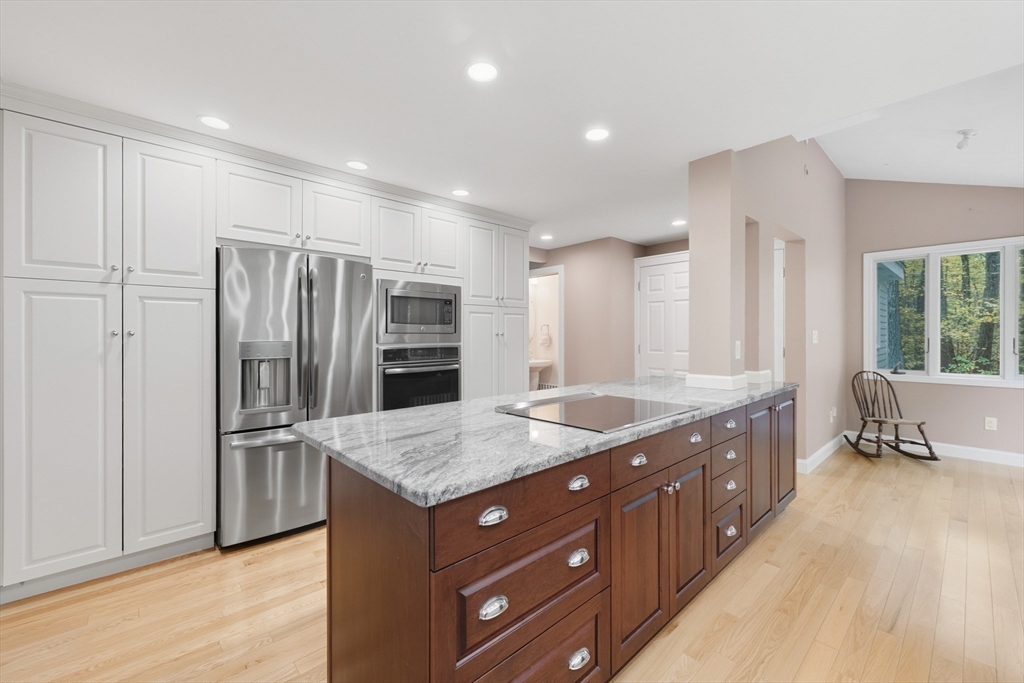 56 Century Mill Road Bolton, MA 01740 - Photo 8 of 41 a kitchen with stainless steel appliances granite countertop a refrigerator and a sink