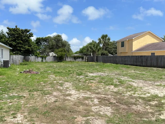 a backyard of a house with lots of green space