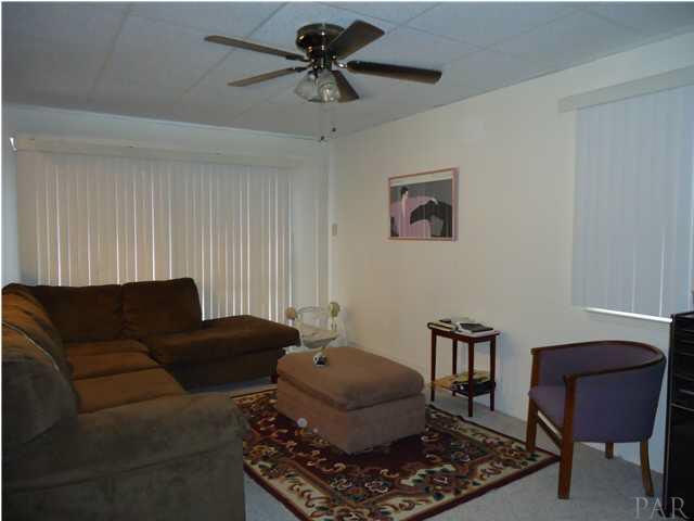 4264 Sea Port Road Pace, FL 32571 - Photo 4 of 13 Enclosed Garage
