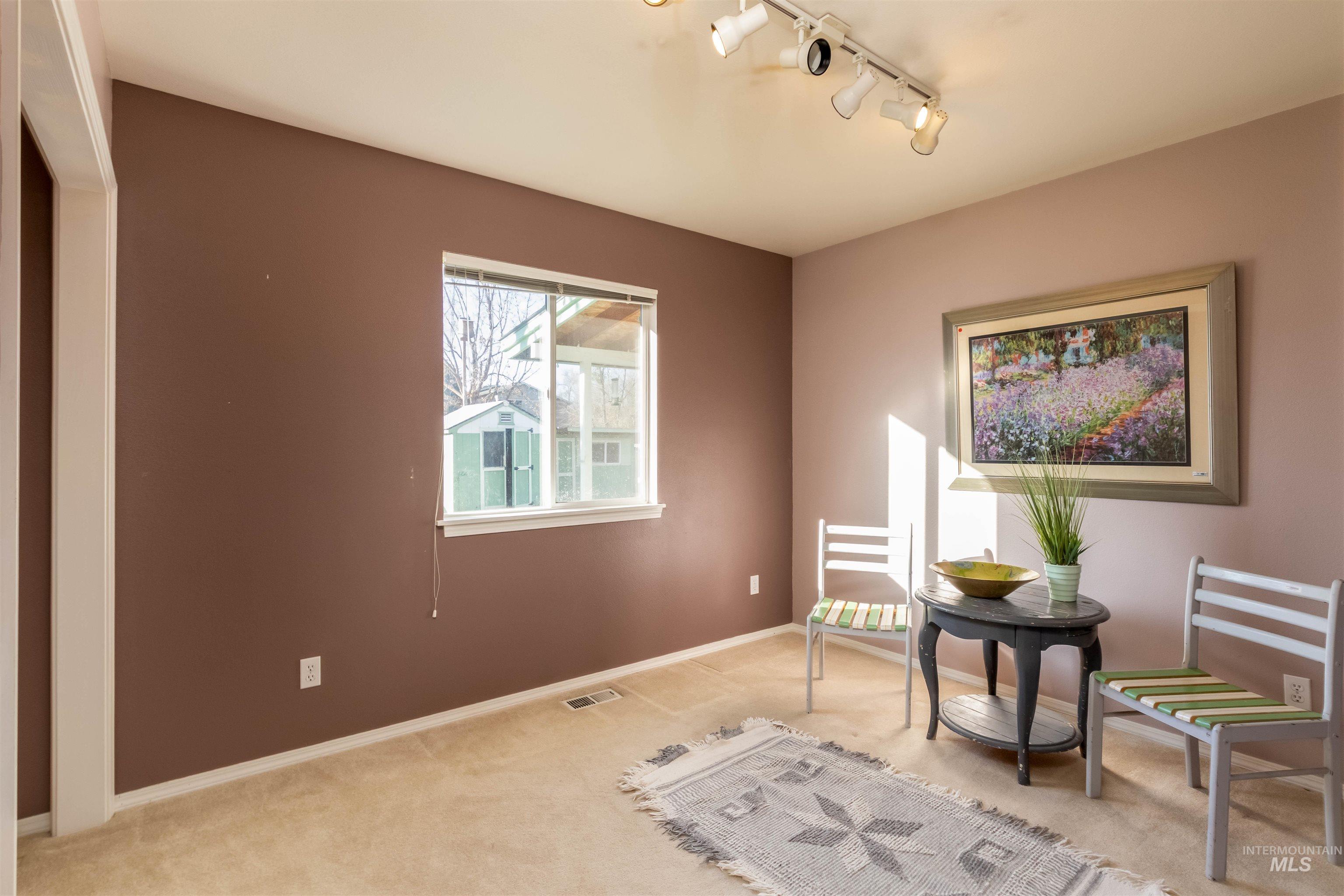 1811 Cleveland Street Boise, ID 83705 - Photo 18 of 30 Living area featuring track lighting and carpet