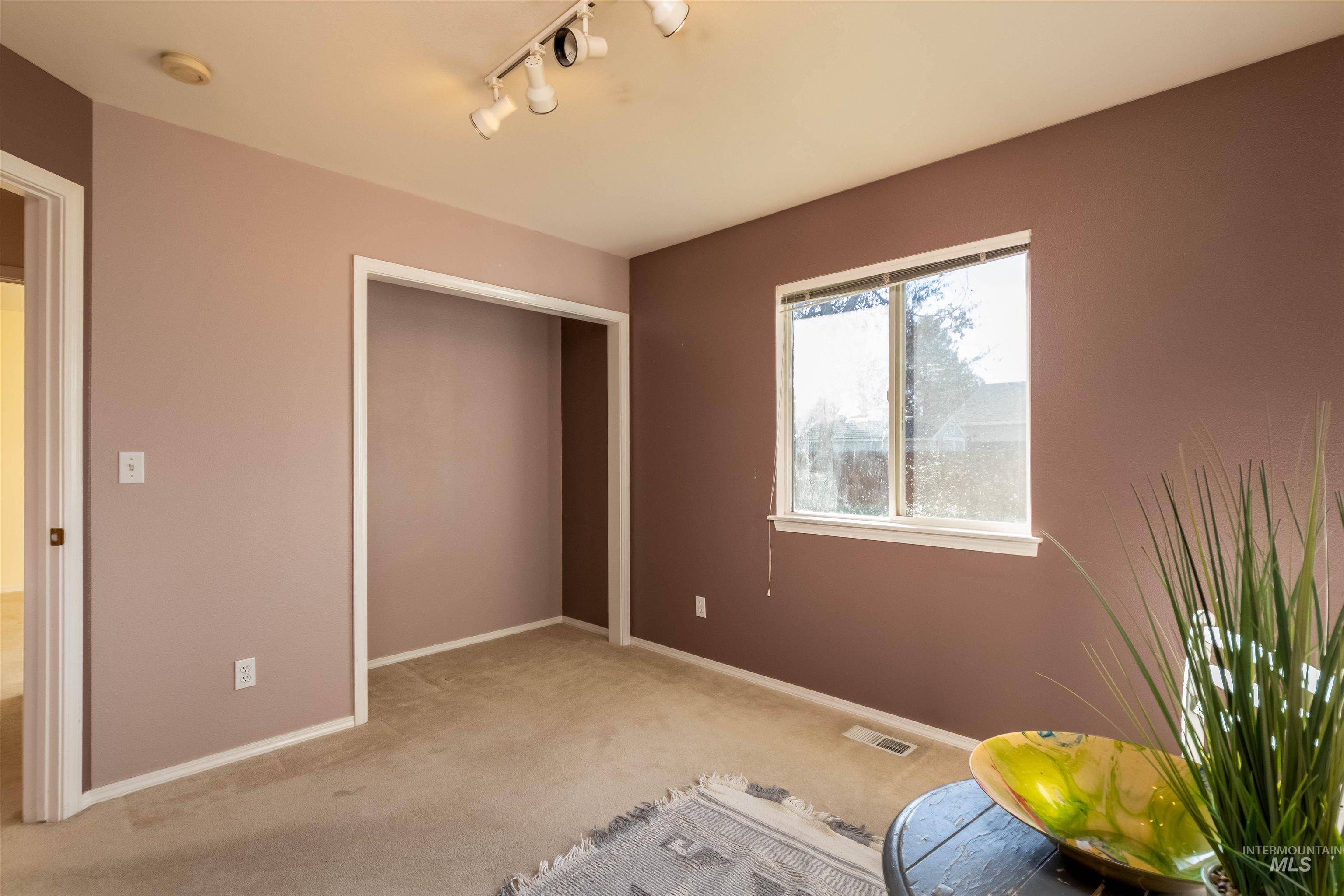 1811 Cleveland Street Boise, ID 83705 - Photo 19 of 30 Carpeted bedroom with a closet and track lighting