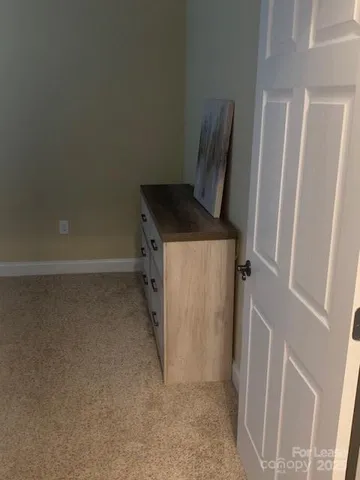 a view of storage and utility room with refrigerator