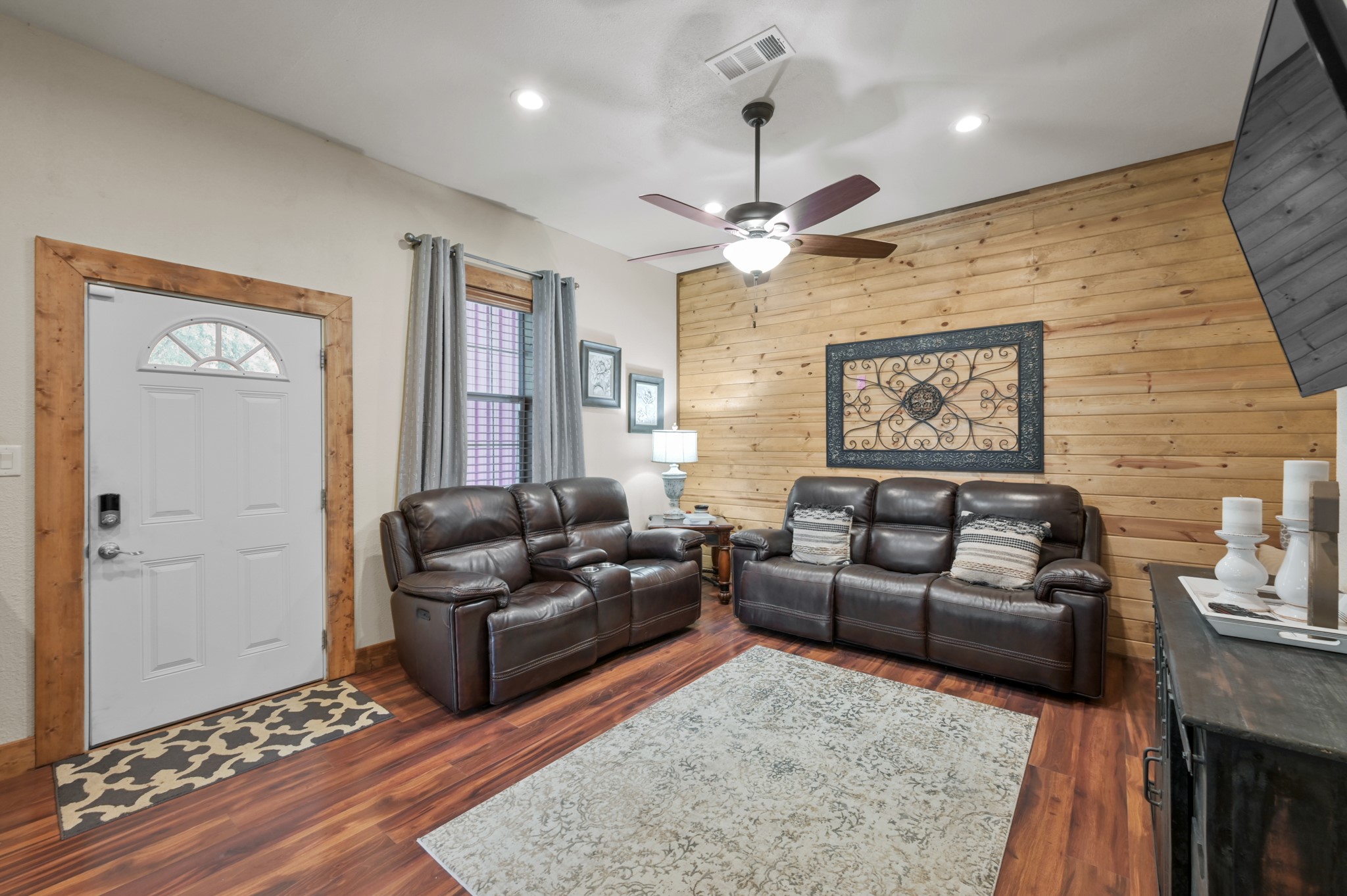 15306 Rabon Chapel Road Montgomery, TX 77316 - Photo 11 of 48 a living room with furniture and a flat screen tv