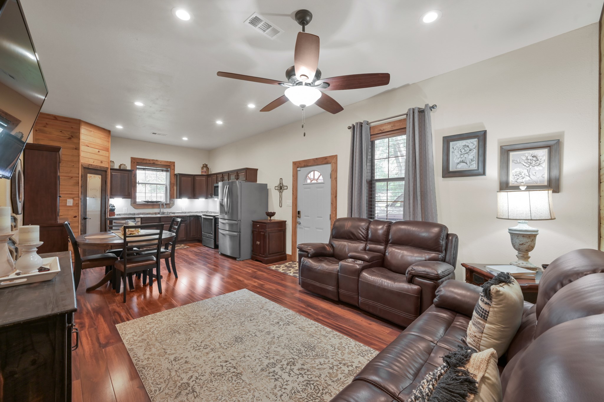 15306 Rabon Chapel Road Montgomery, TX 77316 - Photo 12 of 48 a living room with furniture kitchen view and a dining table