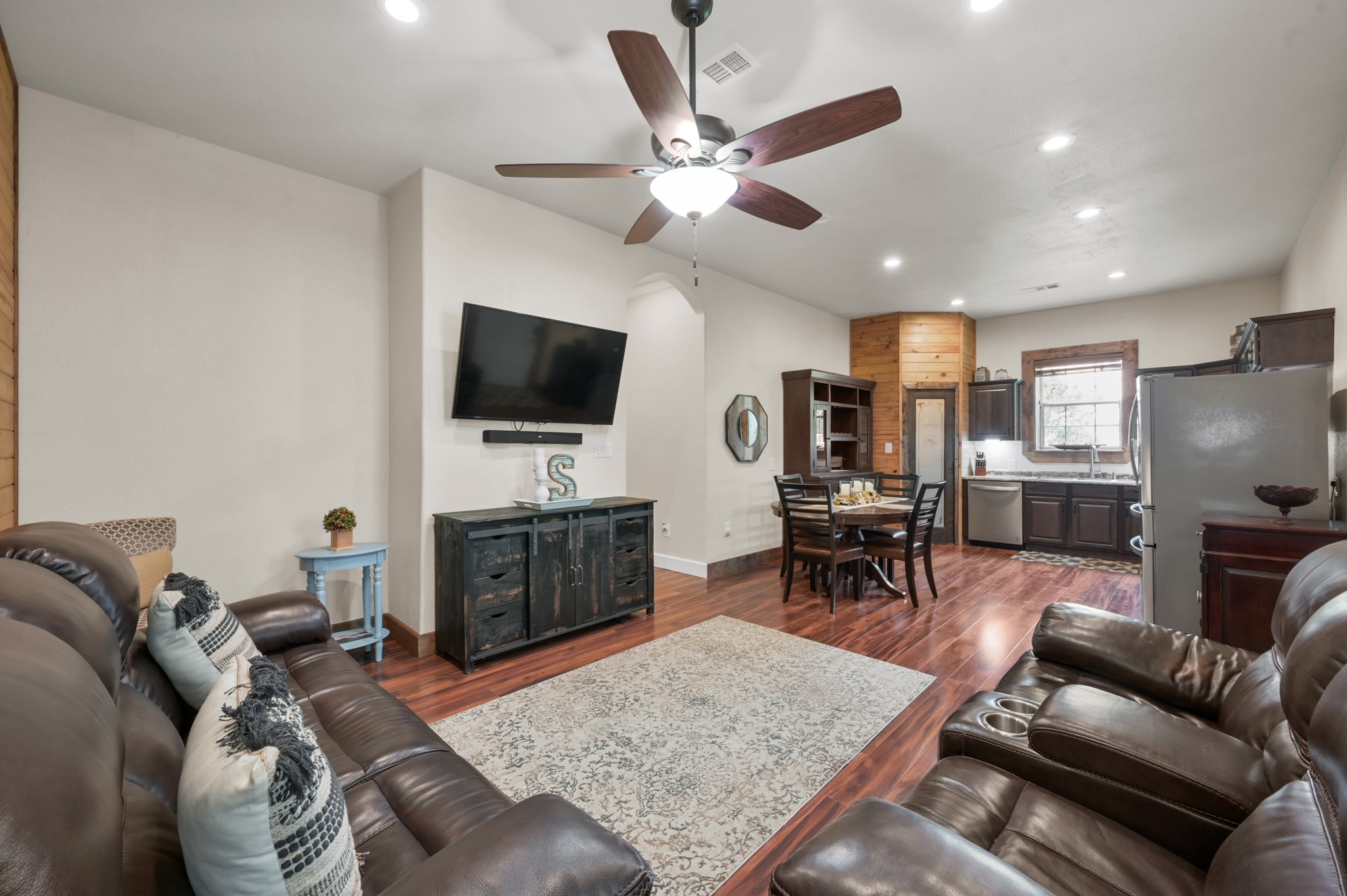 15306 Rabon Chapel Road Montgomery, TX 77316 - Photo 13 of 48 a living room with furniture and a flat screen tv with kitchen view