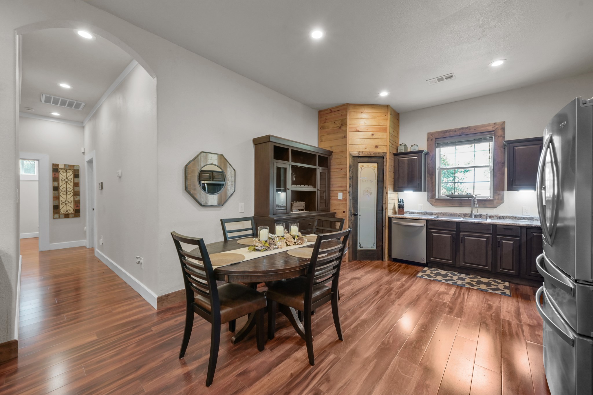 15306 Rabon Chapel Road Montgomery, TX 77316 - Photo 14 of 48 a view of a dining room with furniture and wooden floor