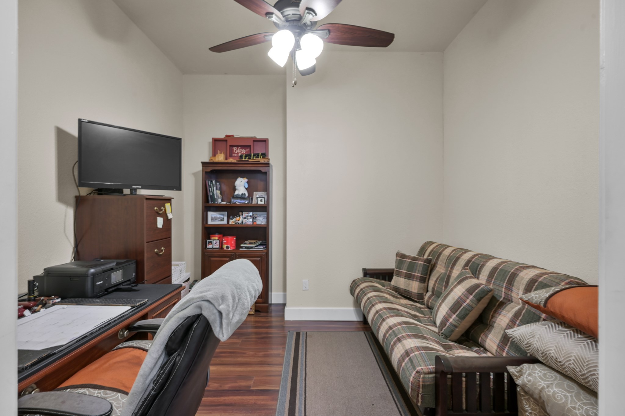 15306 Rabon Chapel Road Montgomery, TX 77316 - Photo 20 of 48 a living room with furniture a flat screen tv and gym equipment