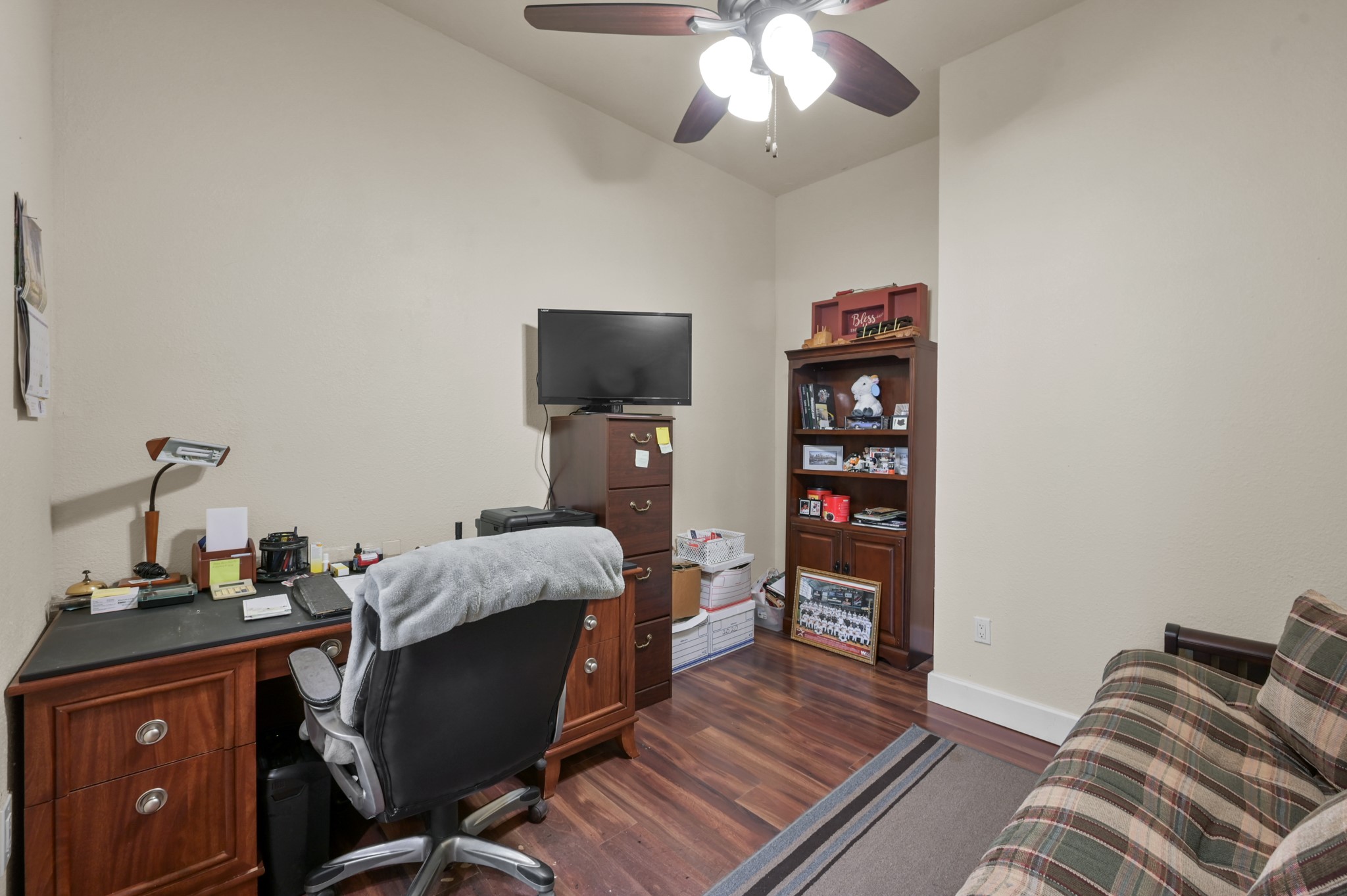 15306 Rabon Chapel Road Montgomery, TX 77316 - Photo 22 of 48 a bedroom with furniture and a flat screen tv
