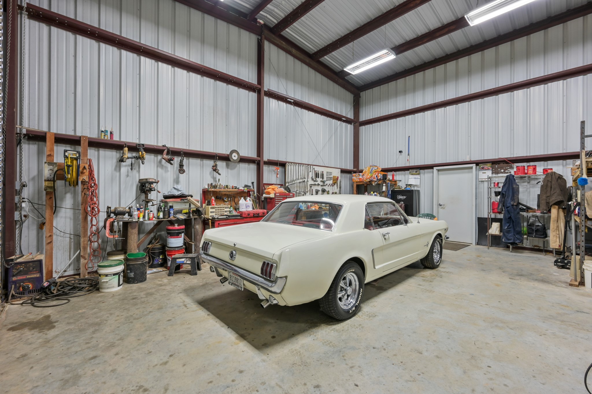 15306 Rabon Chapel Road Montgomery, TX 77316 - Photo 35 of 48 a car and bike parked in a garage