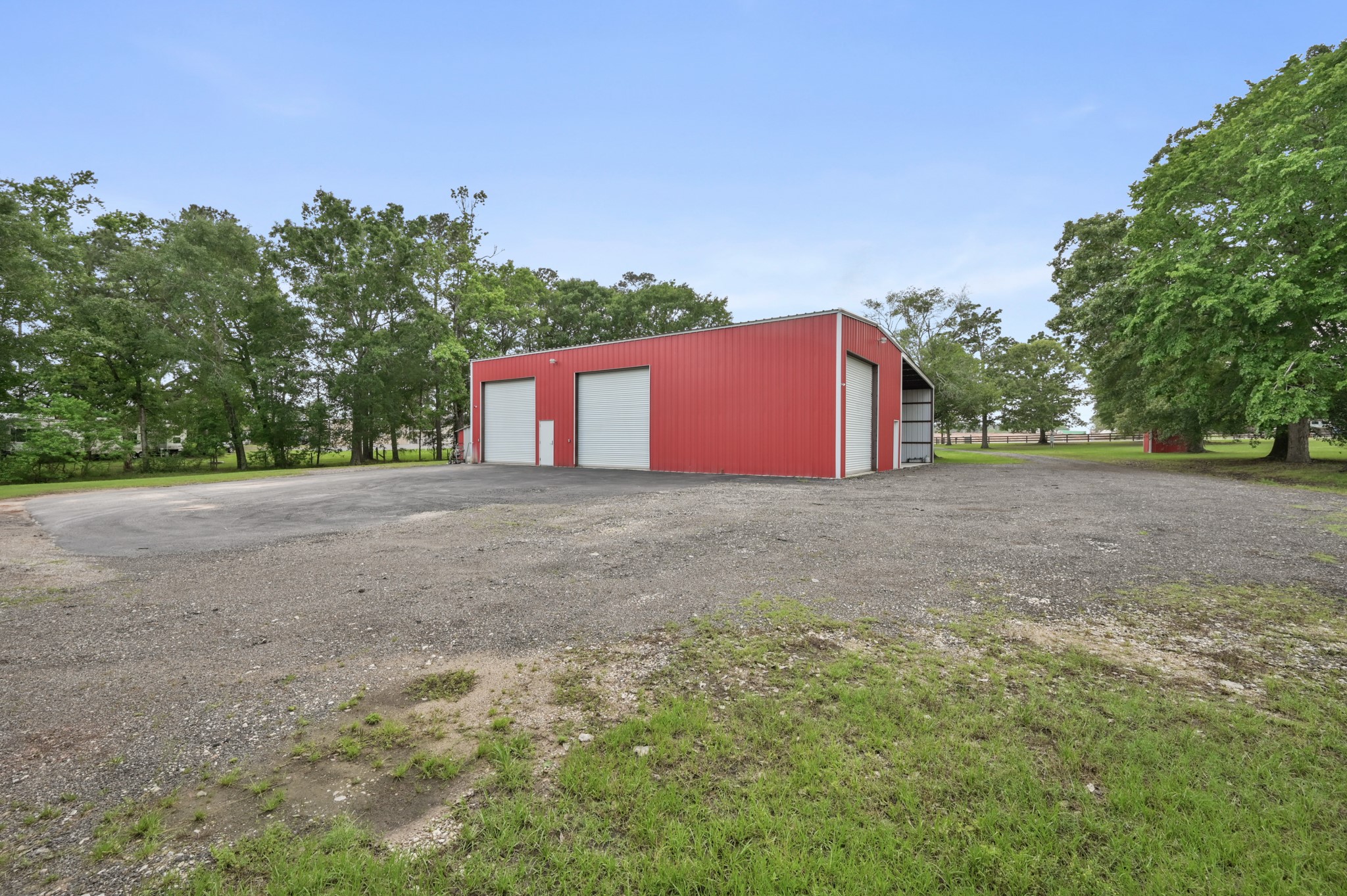15306 Rabon Chapel Road Montgomery, TX 77316 - Photo 41 of 48 a backyard of a house with lots of green space