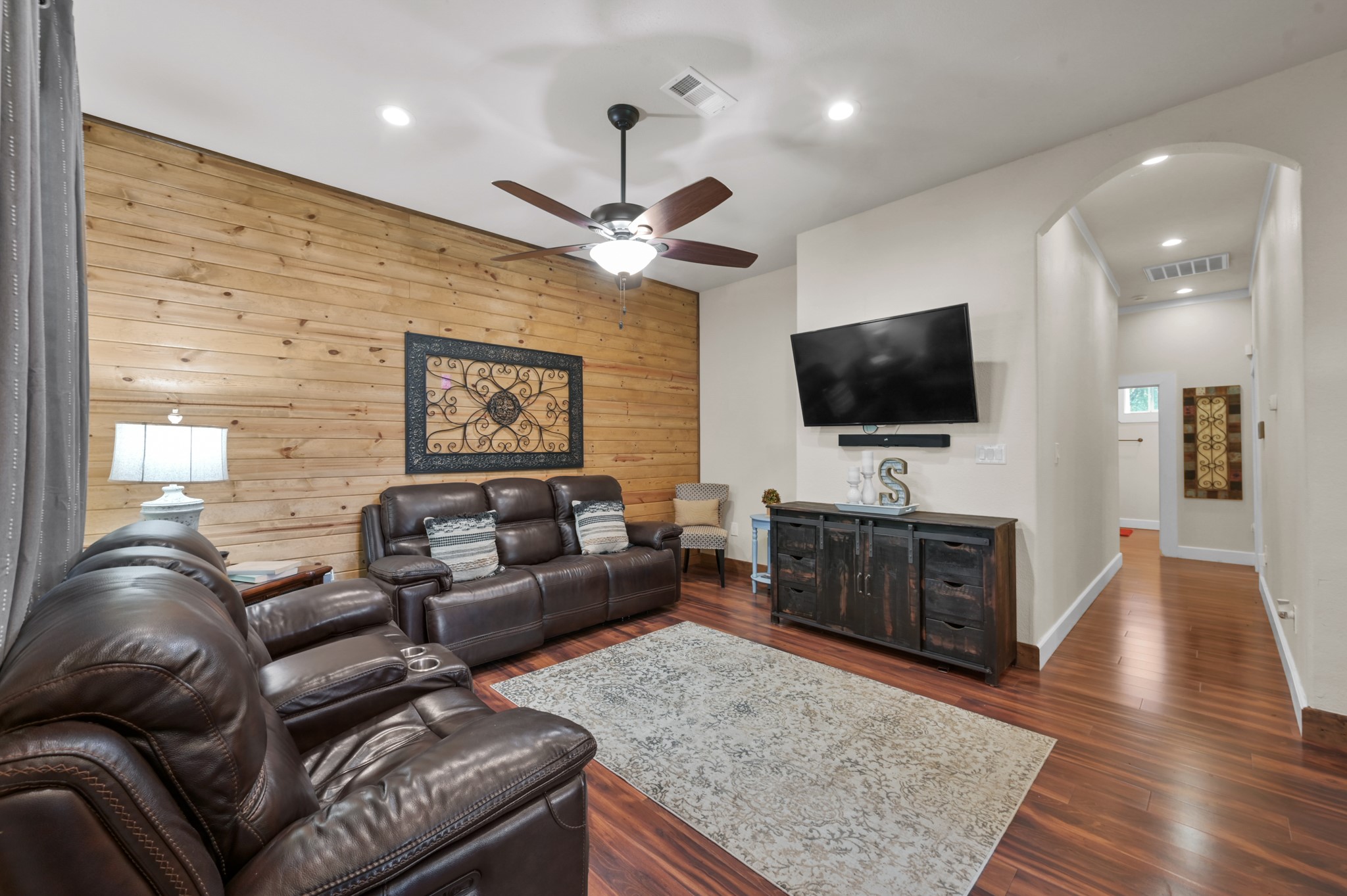 15306 Rabon Chapel Road Montgomery, TX 77316 - Photo 9 of 48 a living room with furniture and a flat screen tv