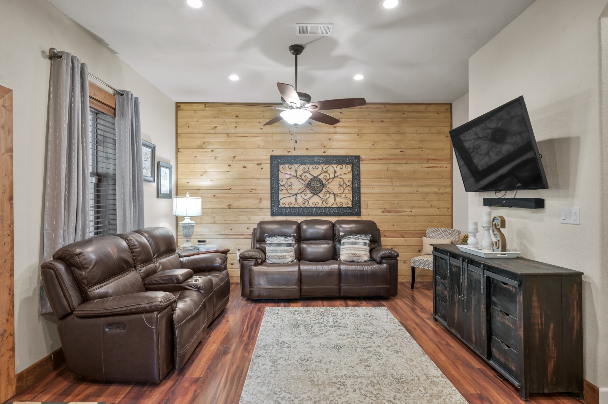 15306 Rabon Chapel Road Montgomery, TX 77316 - Photo 10 of 48 a living room with furniture and a flat screen tv