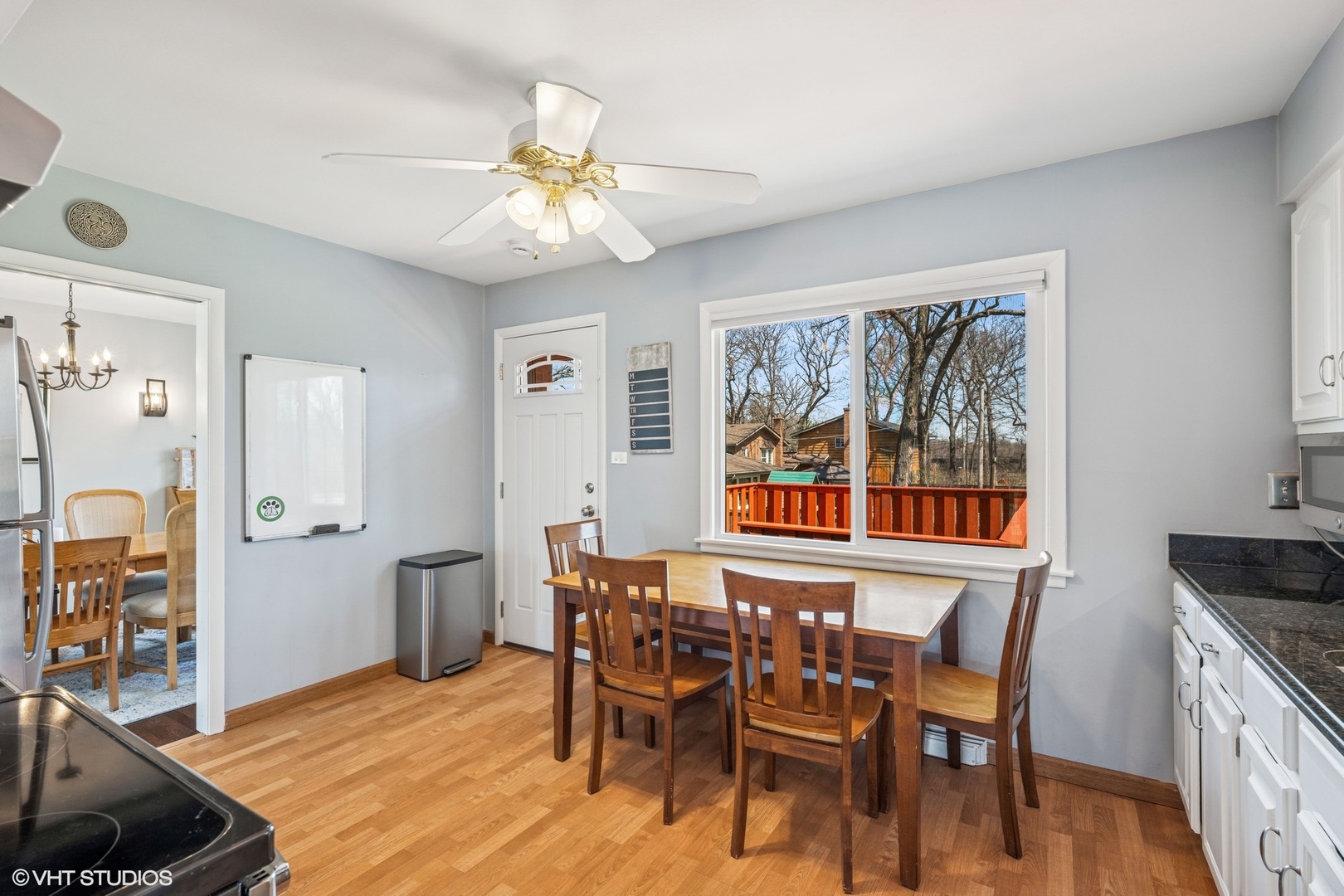 761 Kipling Place Deerfield, IL 60015 - Photo 11 of 27 a view of a dining room with furniture wooden floor and a chandelier