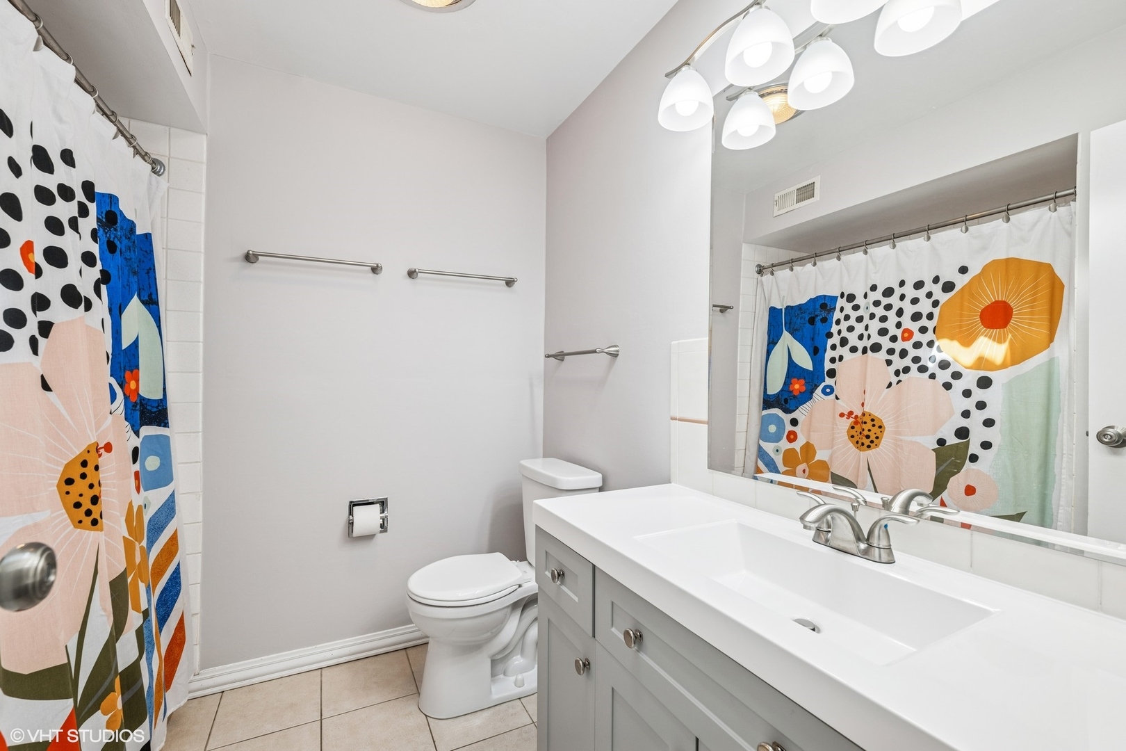 761 Kipling Place Deerfield, IL 60015 - Photo 12 of 27 a bathroom with a sink mirror vanity and toilet