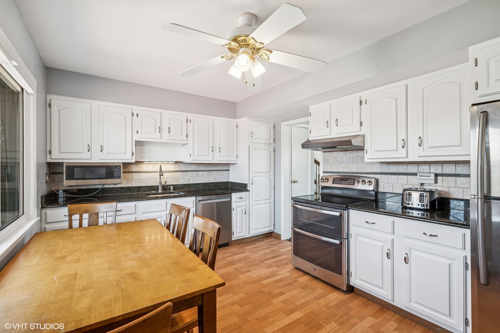761 Kipling Place Deerfield, IL 60015 - Photo 10 of 27 a kitchen with stainless steel appliances white cabinets and a sink