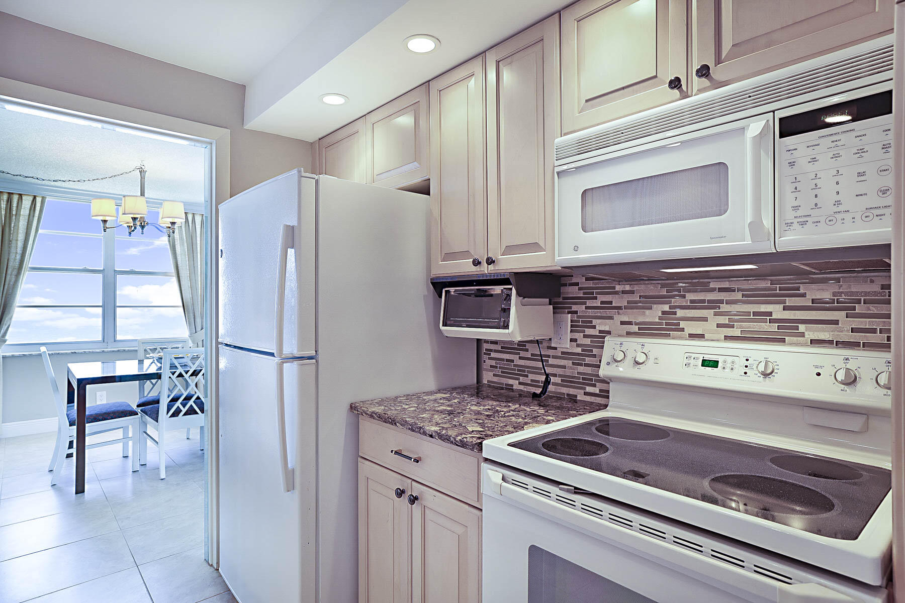 2121 North Ocean Boulevard, Unit 1707E Boca Raton, FL 33431 - Photo 13 of 61 KITCHEN TO DINING AREA