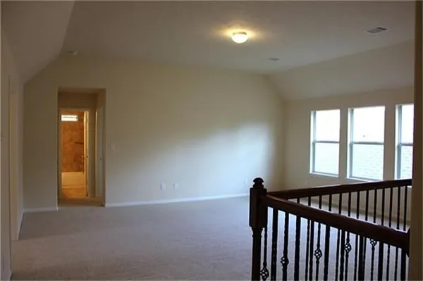 a view of hallway with windows