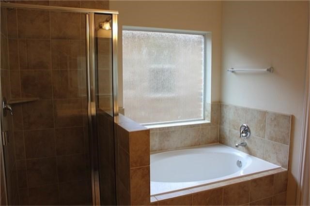 5110 Lakota Trail Spring, TX 77388 - Photo 9 of 19 a bathroom with a bathtub and shower