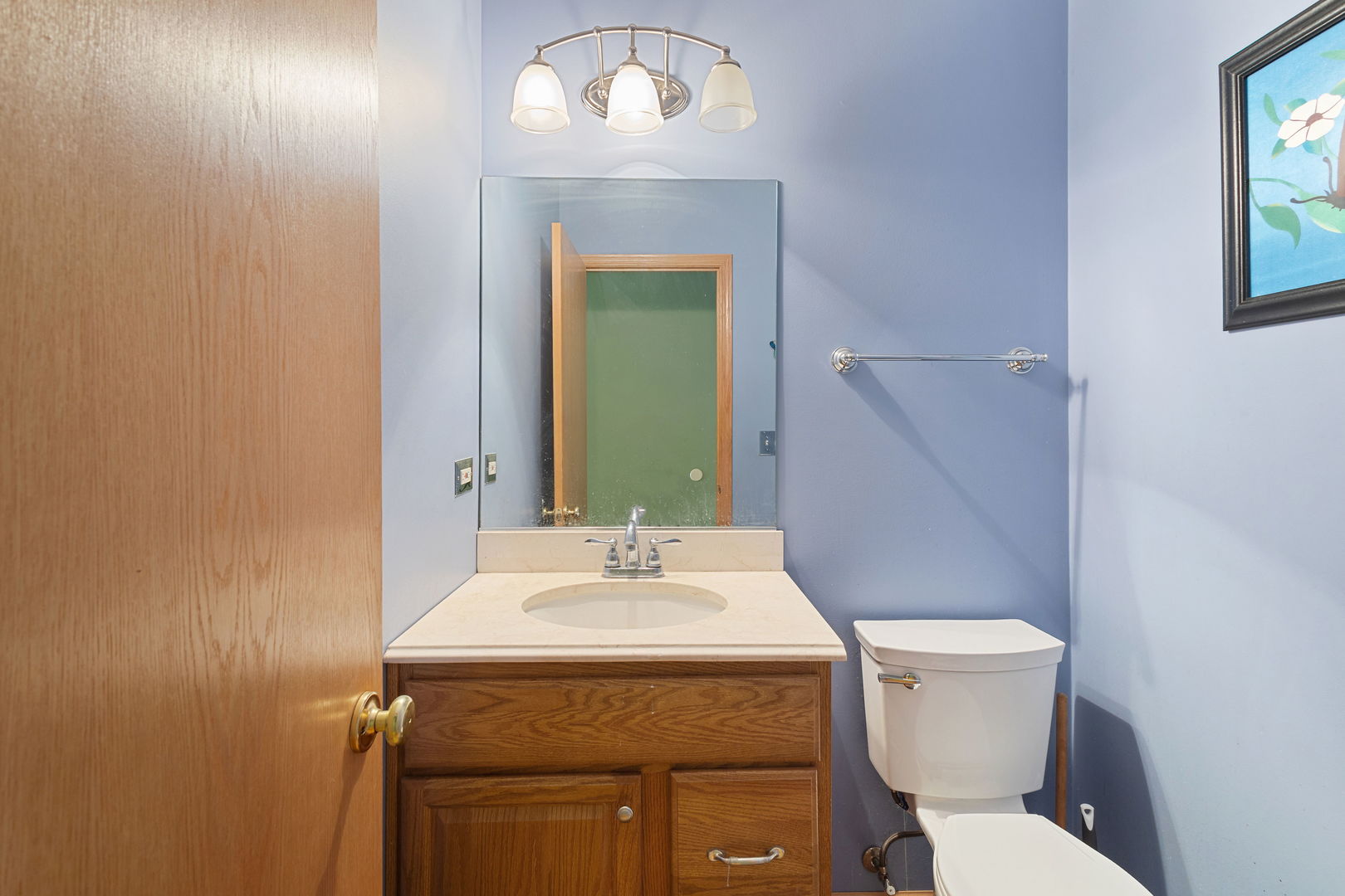 17537 Gilbert Drive Lockport, IL 60441 - Photo 12 of 16 a bathroom with a toilet sink and mirror
