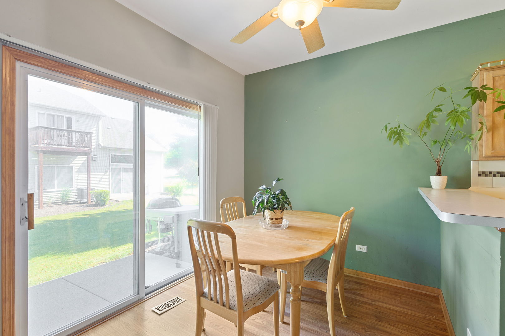 17537 Gilbert Drive Lockport, IL 60441 - Photo 8 of 16 a view of a dining room with furniture and wooden floor