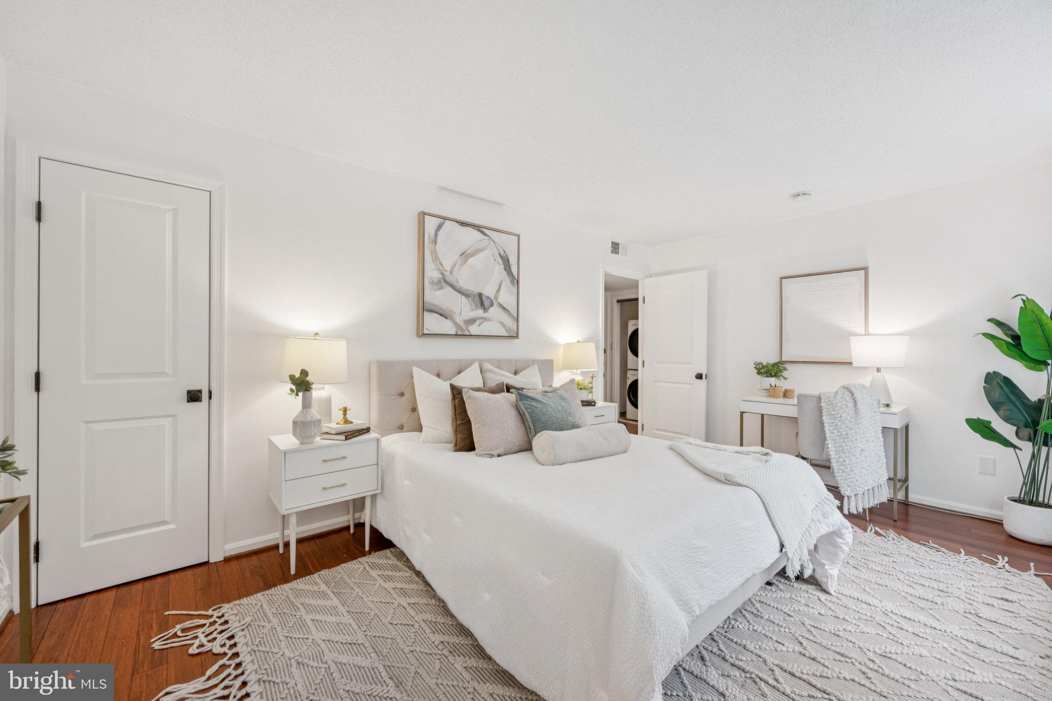 2630 Adams Mill Road Northwest, Unit 103 Washington, DC 20009 - Photo 13 of 24 a bedroom with a bed and a lamp