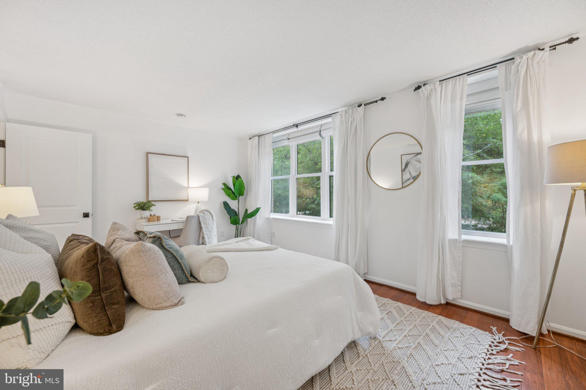 2630 Adams Mill Road Northwest, Unit 103 Washington, DC 20009 - Photo 15 of 24 a bedroom with bed and a window
