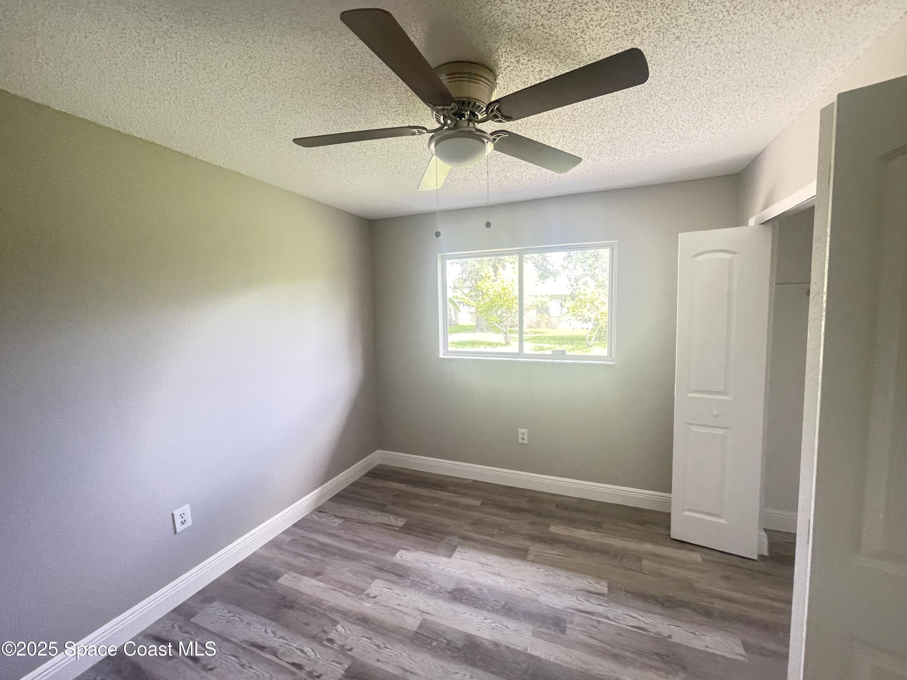 1118 Manatee Drive Rockledge, FL 32955 - Photo 7 of 17 a view of an empty room with a window