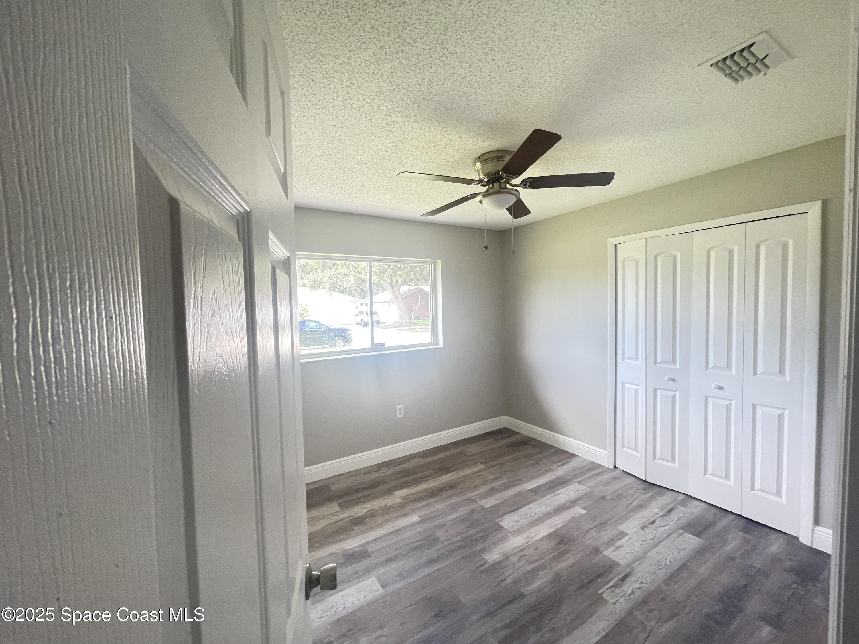 1118 Manatee Drive Rockledge, FL 32955 - Photo 9 of 17 a view of a livingroom with a ceiling fan