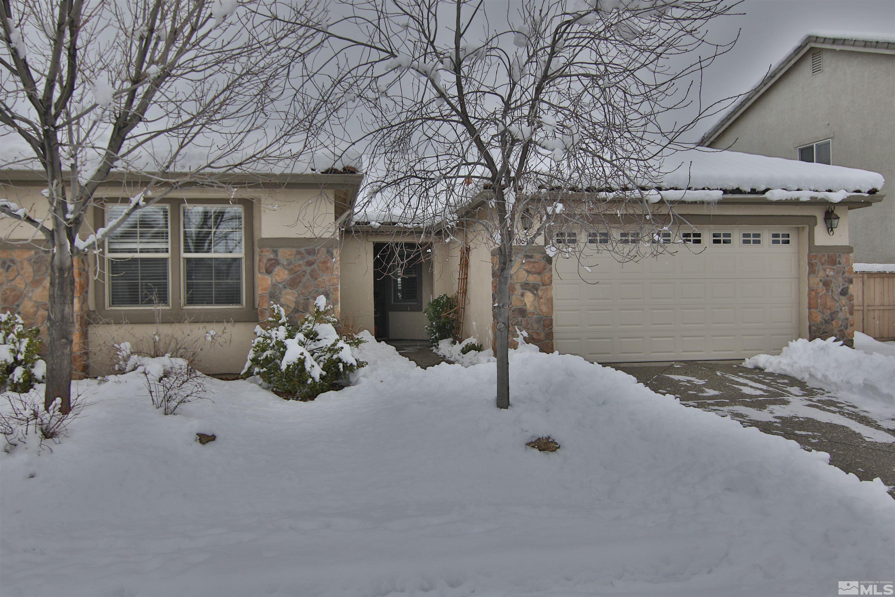 10640 Fire Poppy Circle Reno, NV 89521 - Photo 1 of 27 a view of a house with snow on the road