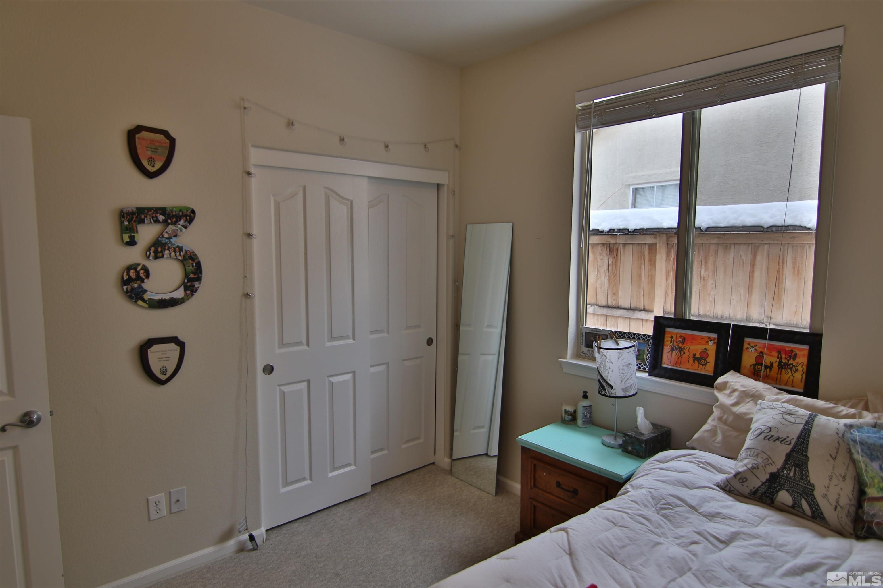 10640 Fire Poppy Circle Reno, NV 89521 - Photo 16 of 27 a living room with furniture and a window