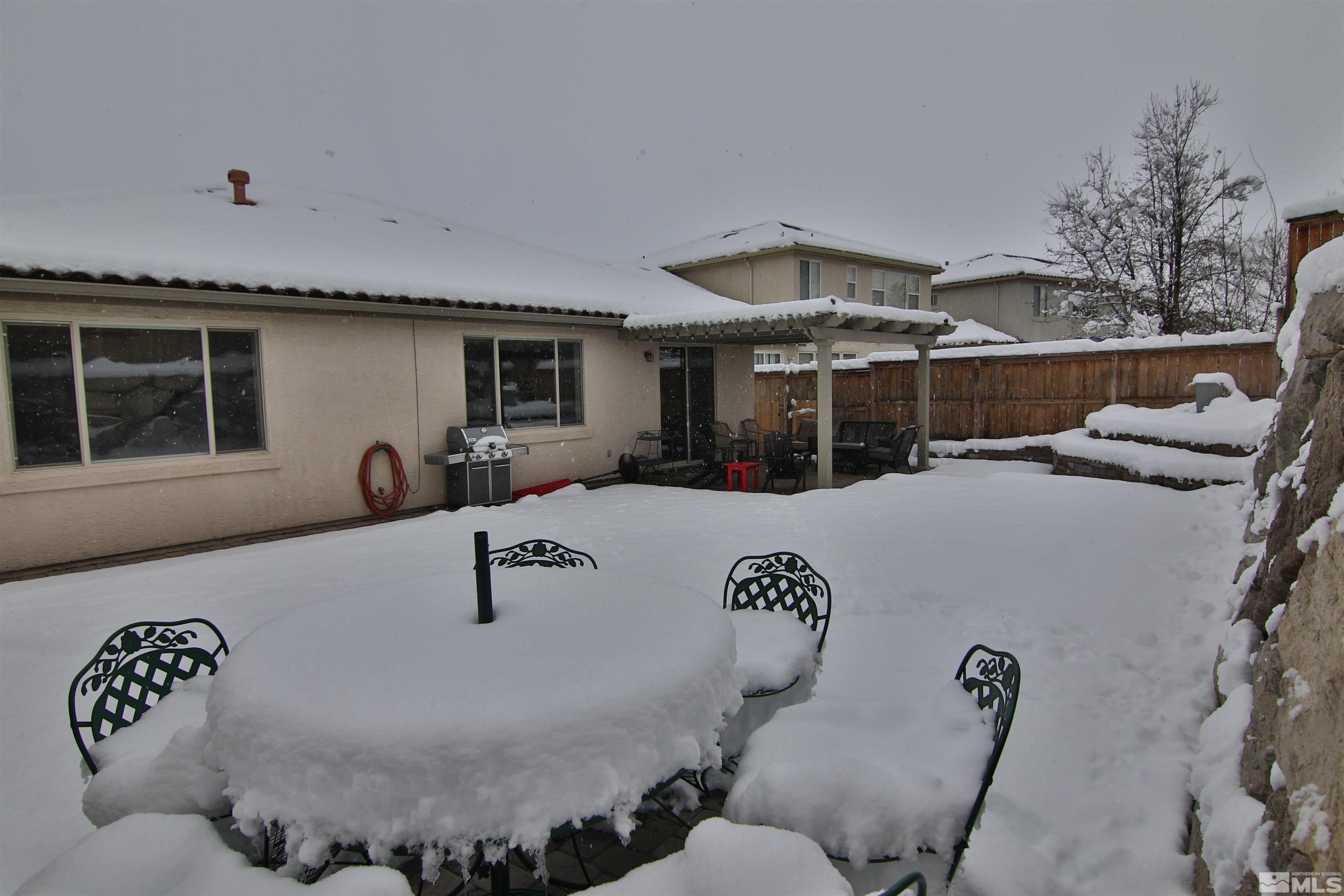 10640 Fire Poppy Circle Reno, NV 89521 - Photo 24 of 27 a view of a couches and dinning table and chair in the patio