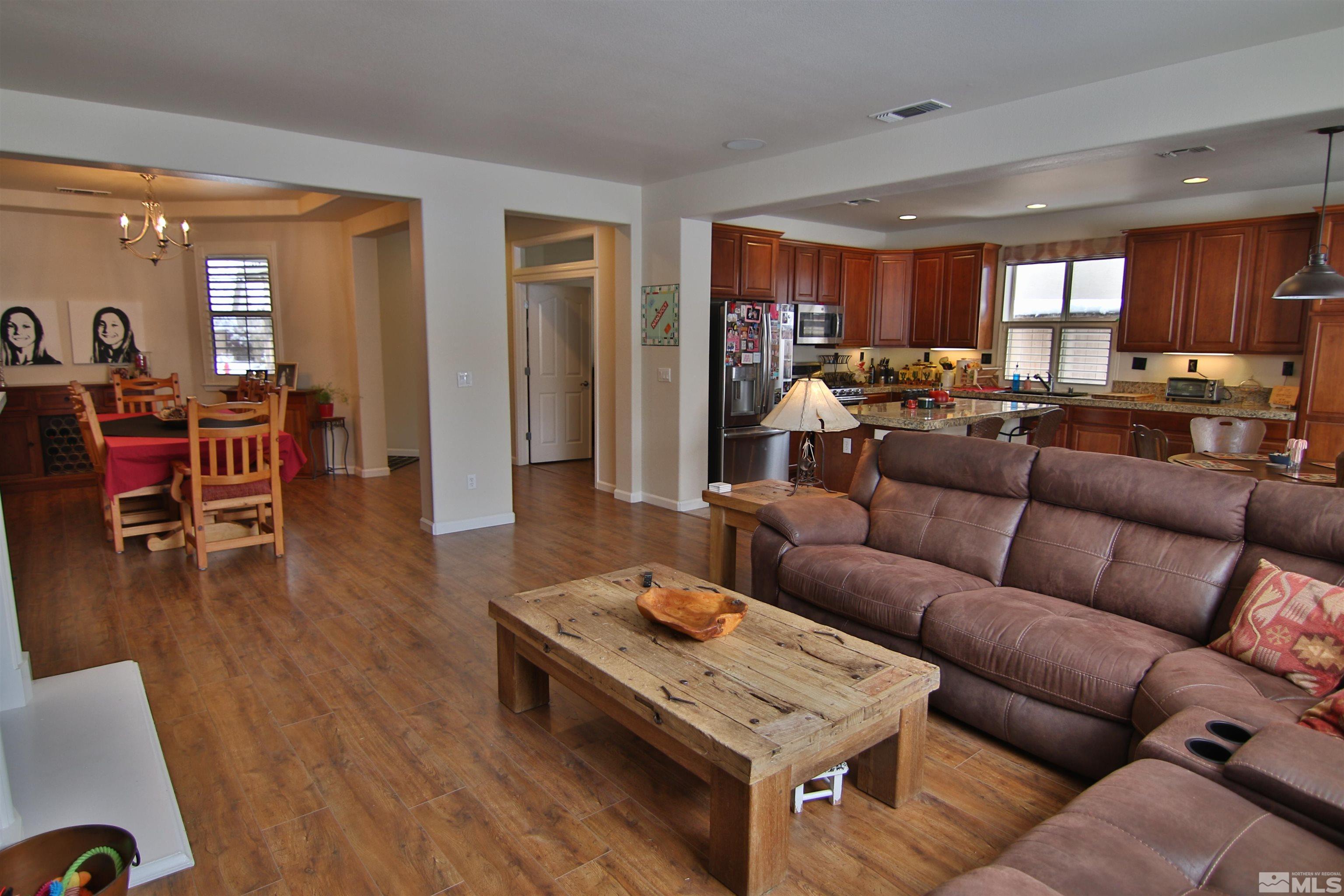10640 Fire Poppy Circle Reno, NV 89521 - Photo 4 of 27 a living room with furniture and wooden floor