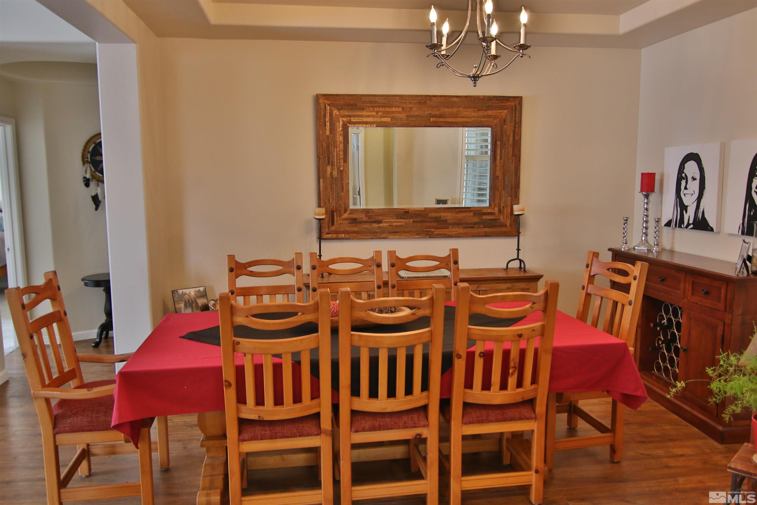 10640 Fire Poppy Circle Reno, NV 89521 - Photo 8 of 27 a view of a dining room with furniture and wooden floor