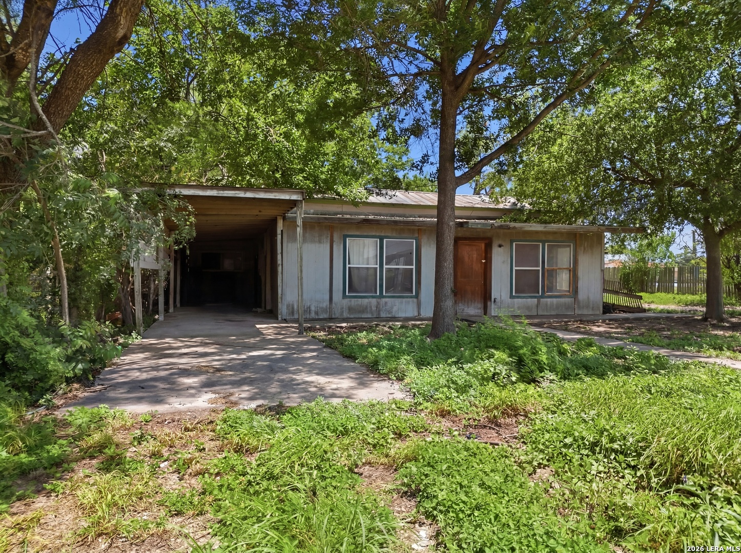 312 East Brazos Street Uvalde, TX 78801 - Photo 1 of 7 a view of a house with a yard