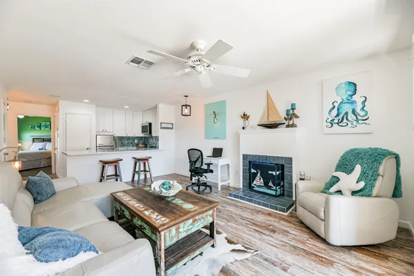 a living room with furniture and a fireplace