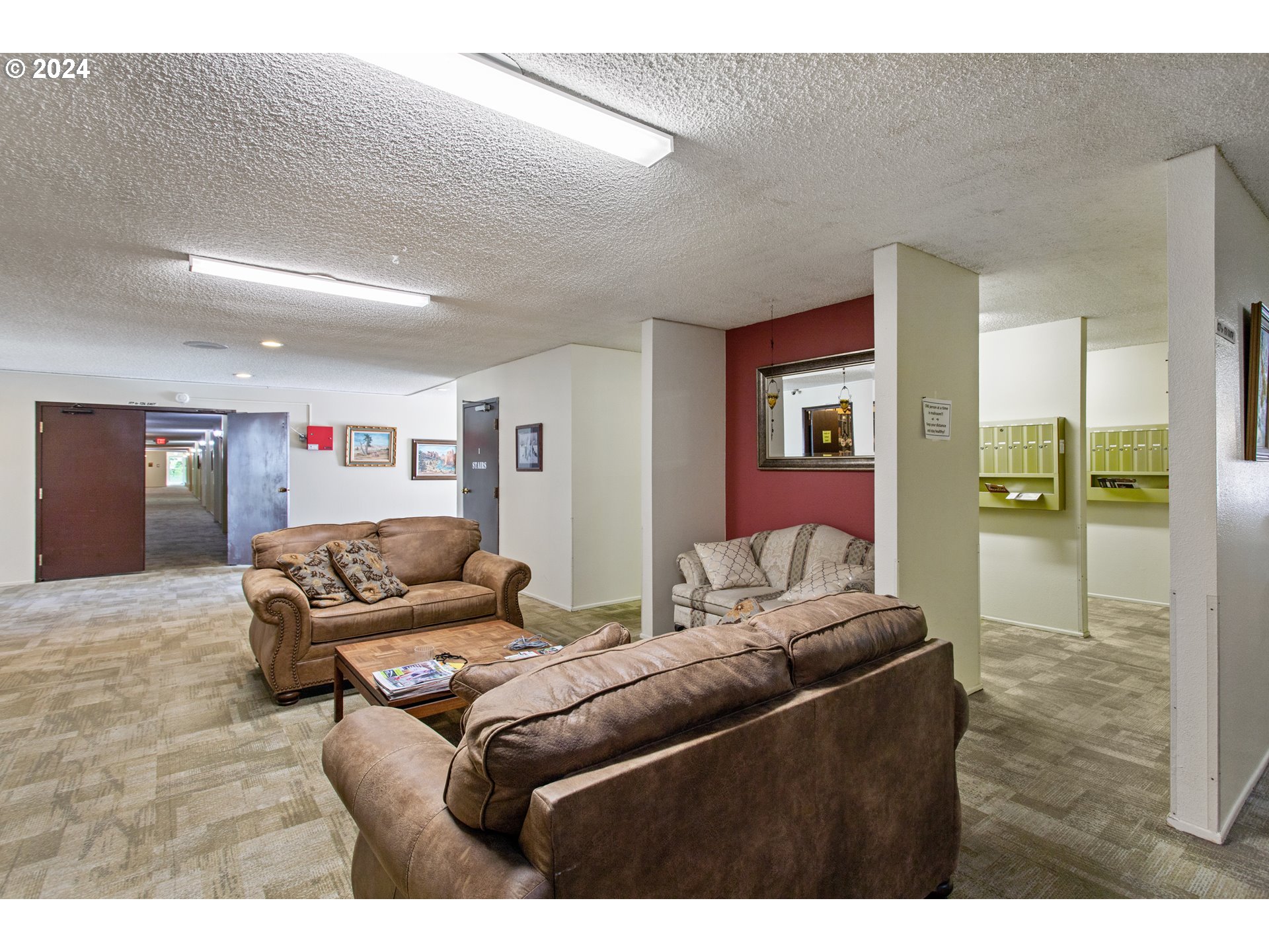 950 Evergreen Road, Unit 210 Woodburn, OR 97071 - Photo 21 of 25 a living room with furniture and a wooden floor