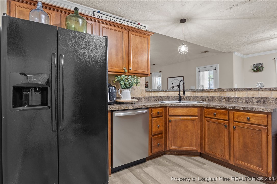 9619 Rockfish Road Raeford, NC 28376 - Photo 15 of 47 a kitchen with stainless steel appliances granite countertop a refrigerator and a sink
